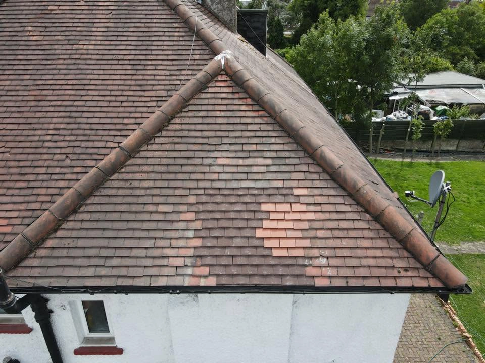 Drone image of a red tiled roof repair by Jakeman Roofing Ltd.